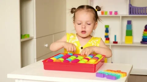 A child is playing at a table in the nursery. Stock Footage 160483702