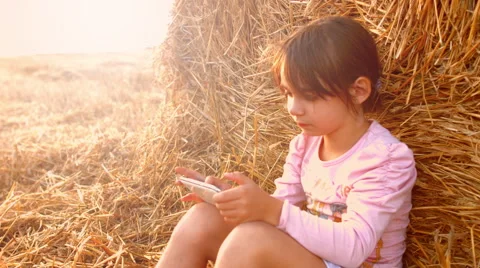 A child playing with a tablet. 4K 30fps ProRes (HQ) Stock Footage 54954592