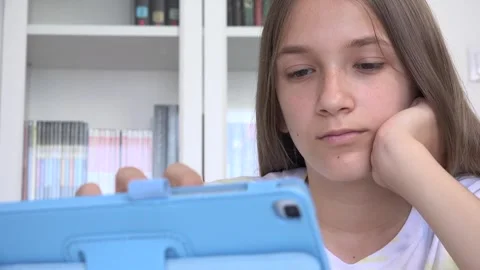 Child Playing Tablet Browsing Internet, Girl Learning on Touchscreen Device Stock Footage 340758259