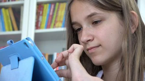 Child Playing Tablet Browsing Internet, Kid Learning on Touchscreen Device, T Stock Photos
