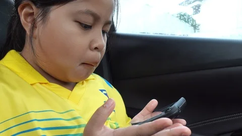 Child Playing a Tablet in Car, View Young Lady Portrait Using a Smartphone 스톡 동영상 110088730