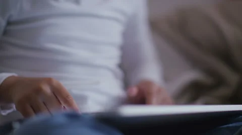 Child playing on a tablet device at home in slow motion Video stock 51711230