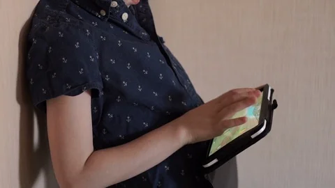 A child is playing a tablet Stock Footage 74974502