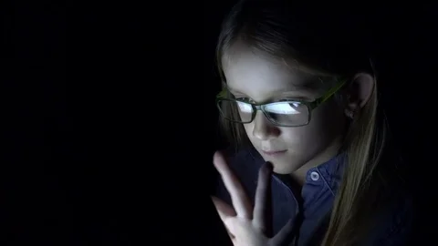 Child Playing Tablet, Glasses School Girl Using Laptop in Night, Black Screen 4K Stock Footage 70590553