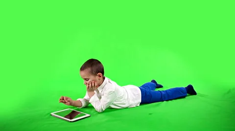 Child playing on a tablet greenscreen Stock-Footage 47748419