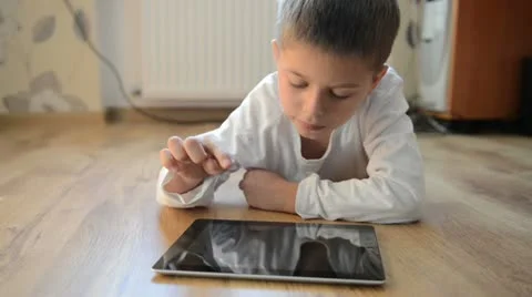 Child playing on a tablet pc Stock Footage 12376833