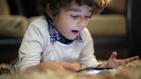 Child Playing On A Tablet Pc Stock Footage 44443368