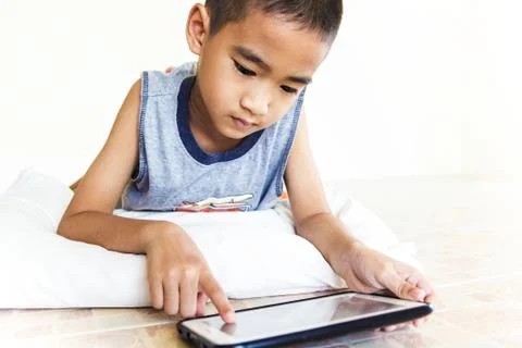 Child playing tablet Stock Photos