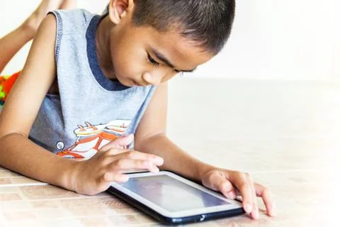 Child playing tablet Stock Photos