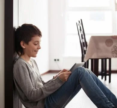 Child playing at tablet Stock Photos
