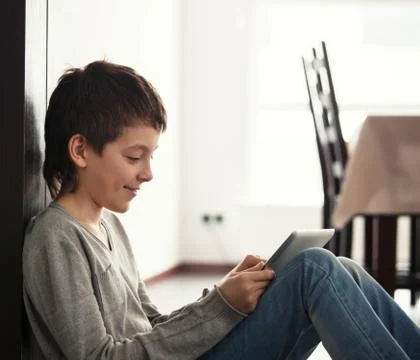Child playing at tablet Stock Photos