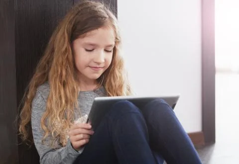 Child playing at tablet Stock Photos