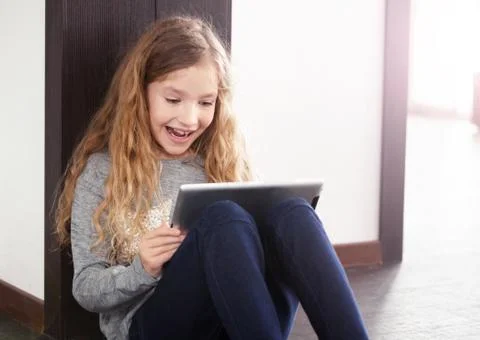 Child playing at tablet Stock Photos