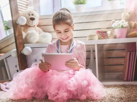 Child is playing with tablet Stock Photos
