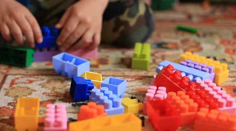 Child playing with a toy constructor Stock Footage 64066185