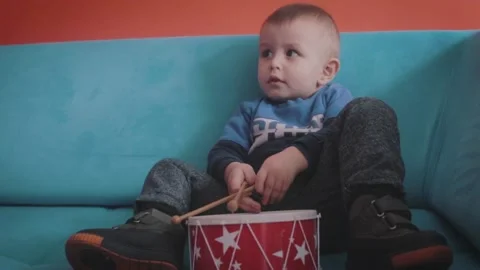 Child Playing With Toy Drum Set Stock Footage 199659857