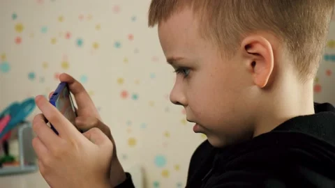 Child Playing Video Game In Cell Phone Stock Footage 170560101