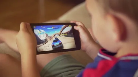 Child playing video  game on the smartphone Stock Footage 80237976