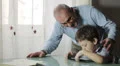 child playing with a video game together his grandfather HD Footage