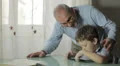 child playing with a video game together his grandfather HD Footage