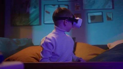 Child playing Virtual Reality Headsets, kid boy using vr ar glasses, watching Stock Footage 153090791