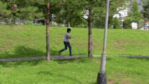 The child is playing in the war. Game on green grass. Summer vacation. Video stock 78210948