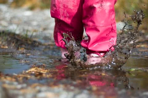 Child playing in water! Stock Photos
