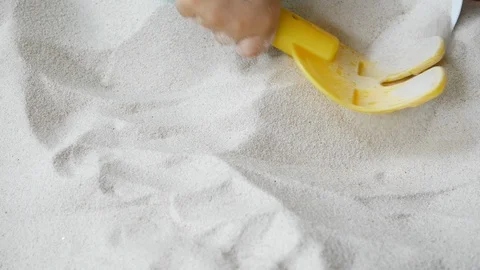 Child playing white sand on the beach, close-up scene Video stock 89779781
