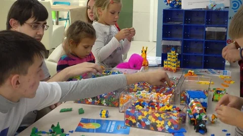 Child plays with a builder kit Video stock 80467320