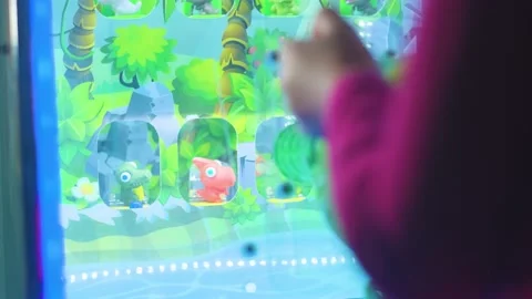 The child plays in the children's game machine knocks down toys visible hands Видео 237309475