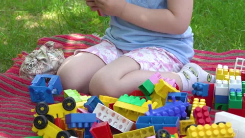 A child plays with colored cubes Stock Footage 230609692