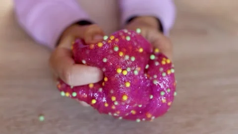 Child plays with colored slime on the table. Child development concept Stock Footage 221330680