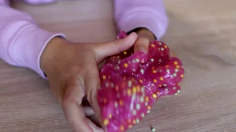 Child plays with colored slime on the table. Child development concept Stock Footage 221330968