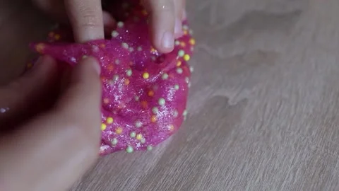 Child plays with colored slime on the table. Child development concept Stock Footage 221331204