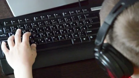 The child plays on the computer. Stock Footage 132754128