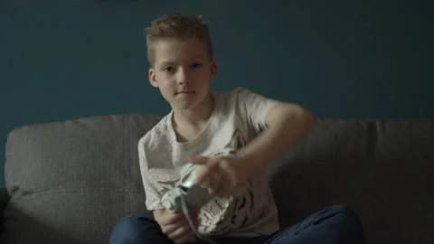 The child plays computer games at home. The child is addicted to computer games Stock Footage 194469241