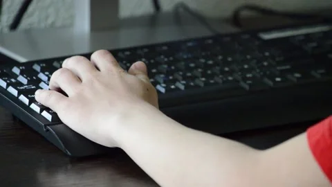 The child plays on the computer. Hand close-up Stock Footage 132754145
