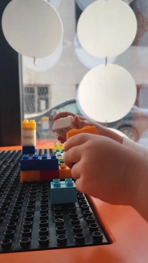A child plays with a construction set Stock Footage 306452779
