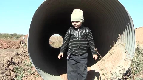 Child plays on a construction site Stock Footage 953691