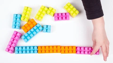 Child plays with constructor on white background Stock-Fotos