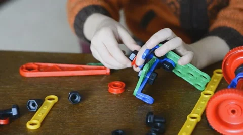 A child plays the designer Stock Footage 60582875