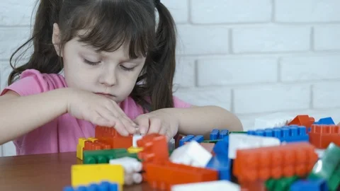 The child plays with the designer. Stock Footage 102726642