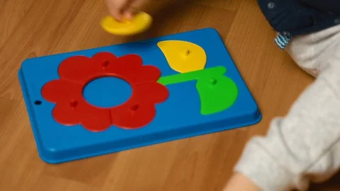 Child plays with designer kit on the floor, top view Vídeo Stock 127752833
