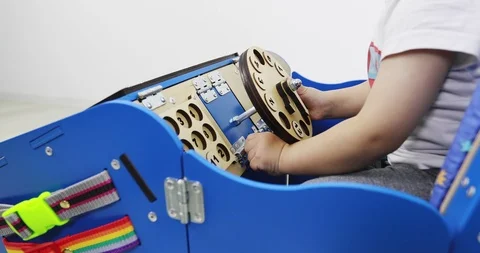 A child plays with a developing machine. Video stock 109689037