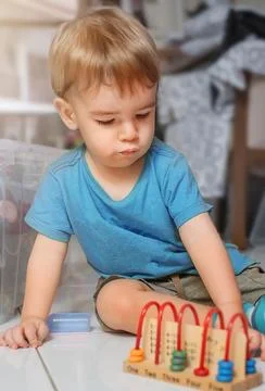 Child plays educational game Stock Photos