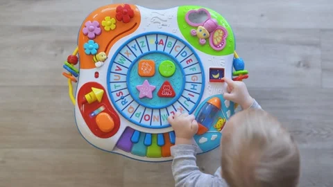 A child plays with a educational toy Stock Footage 305224010