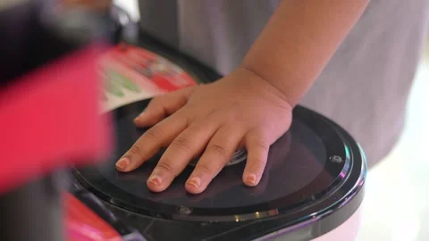 Child plays game with hands on arcade machine Stock Footage 341542229