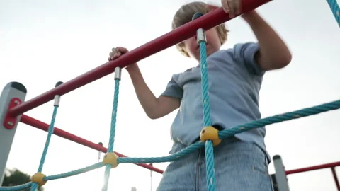 A child plays happily on the playground Stock Footage 255201059