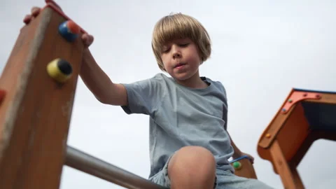 A child plays happily on the playground Stock Footage 255201075