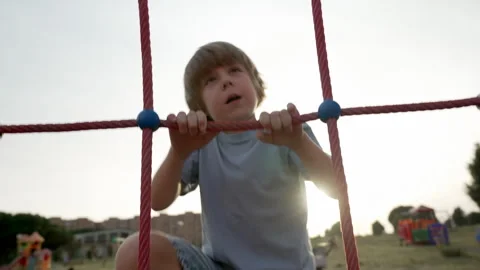 A child plays happily on the playground Stock Footage 255203371